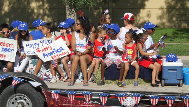 Carlsbad's Fourth of July parade features lowriders, ATV, floats and police and fire vehicles Tuesday on Main Street in Carlsbad.