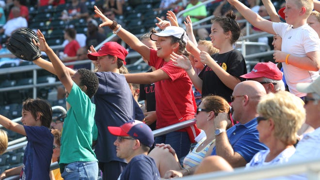 Miracle fans participate in a game between innings in hope to recieve Miracle souvenirs during a game against the Palm Beach Cardinals on Sunday.