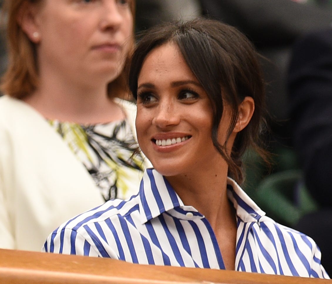 Britain's Meghan, Duchess of Sussex reacts as she sits in the Royal box on Centre Court before watching Serbia's Novak Djokovic play against Spain's Rafael Nadal during the continuation of their men's singles semifinal match during the 2018 Wimbledon