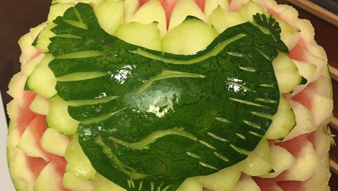 The image of a chicken carved into a watermelon at the Jewish Hospital booth at the 13th Annual Chicken Soup Cook-Off.