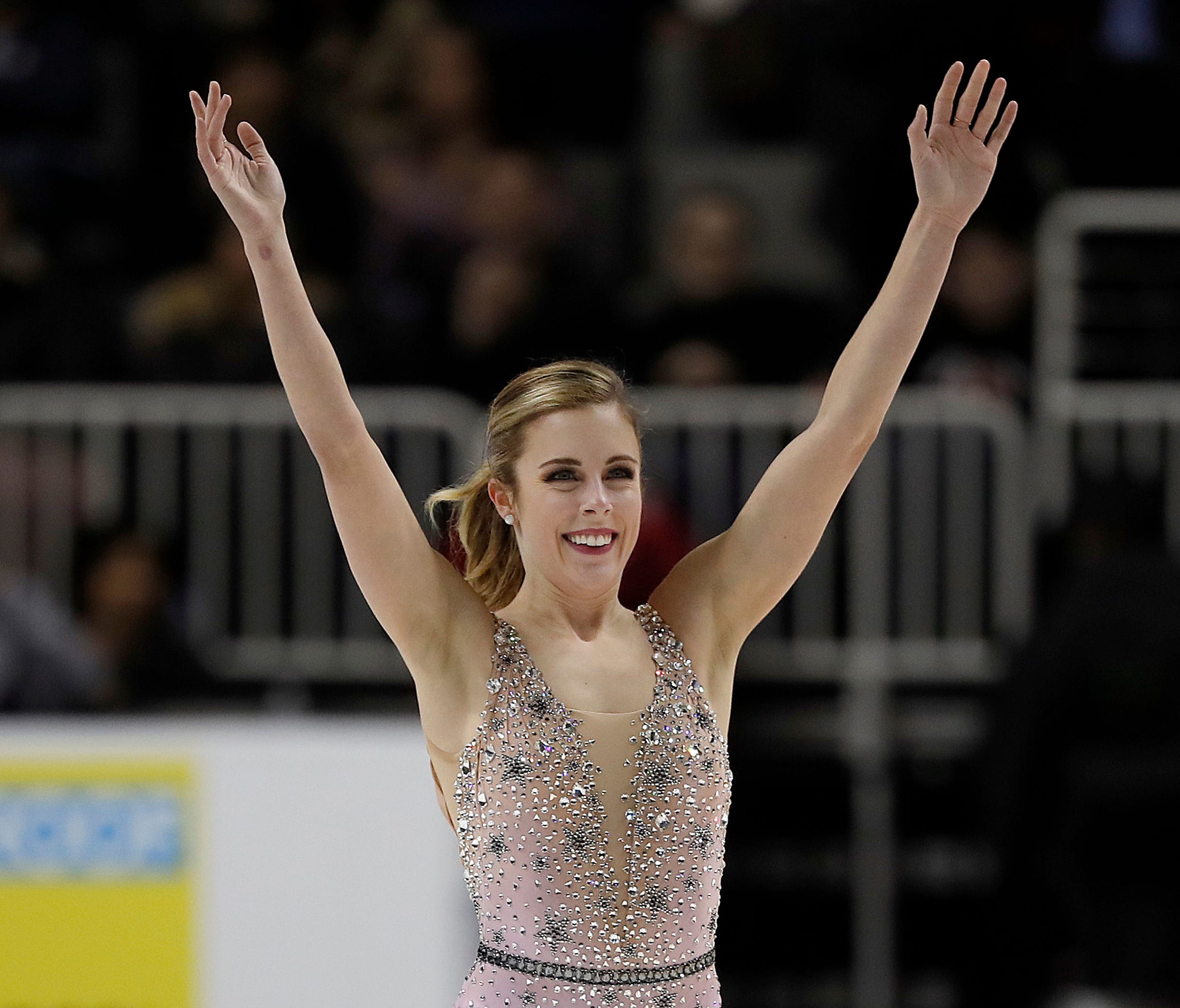 Ashley Wagner smiles after performing during the women's free skate event at the U.S. Figure Skating Championships in San Jose, Calif.