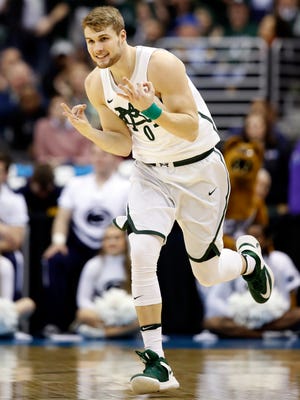 Michigan State  guard Kyle Ahrens celebrates a 3-point basket during the first half of an NCAA college basketball game against Penn State in the Big Ten tournament, Thursday, March 9, 2017, in Washington. (AP Photo/Alex Brandon)