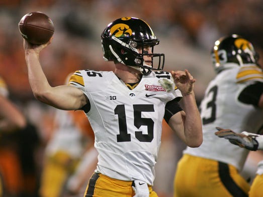 Iowa quarterback Jake Rudock (15) throws in the fourth