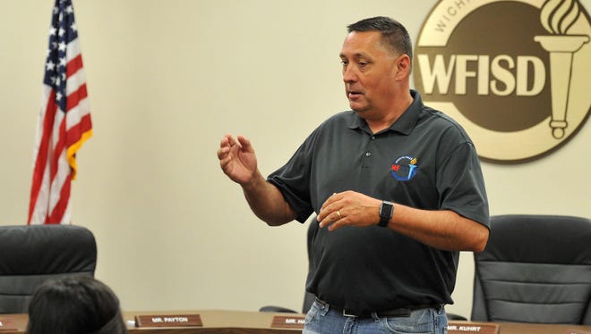 In this file photo, Wichita Falls Independent School District, Superintendent of School, Michael Kurhrt, spoke to a small crowd of students and parents shortly before a scholarship presentation held at the WFISD education center.