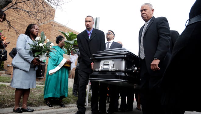 Pallbearers carry the casket of Gill Hill during the funeral service at St. Philip Evangelical Lutheran Church on Saturday, March 12, 2016, in Detroit.