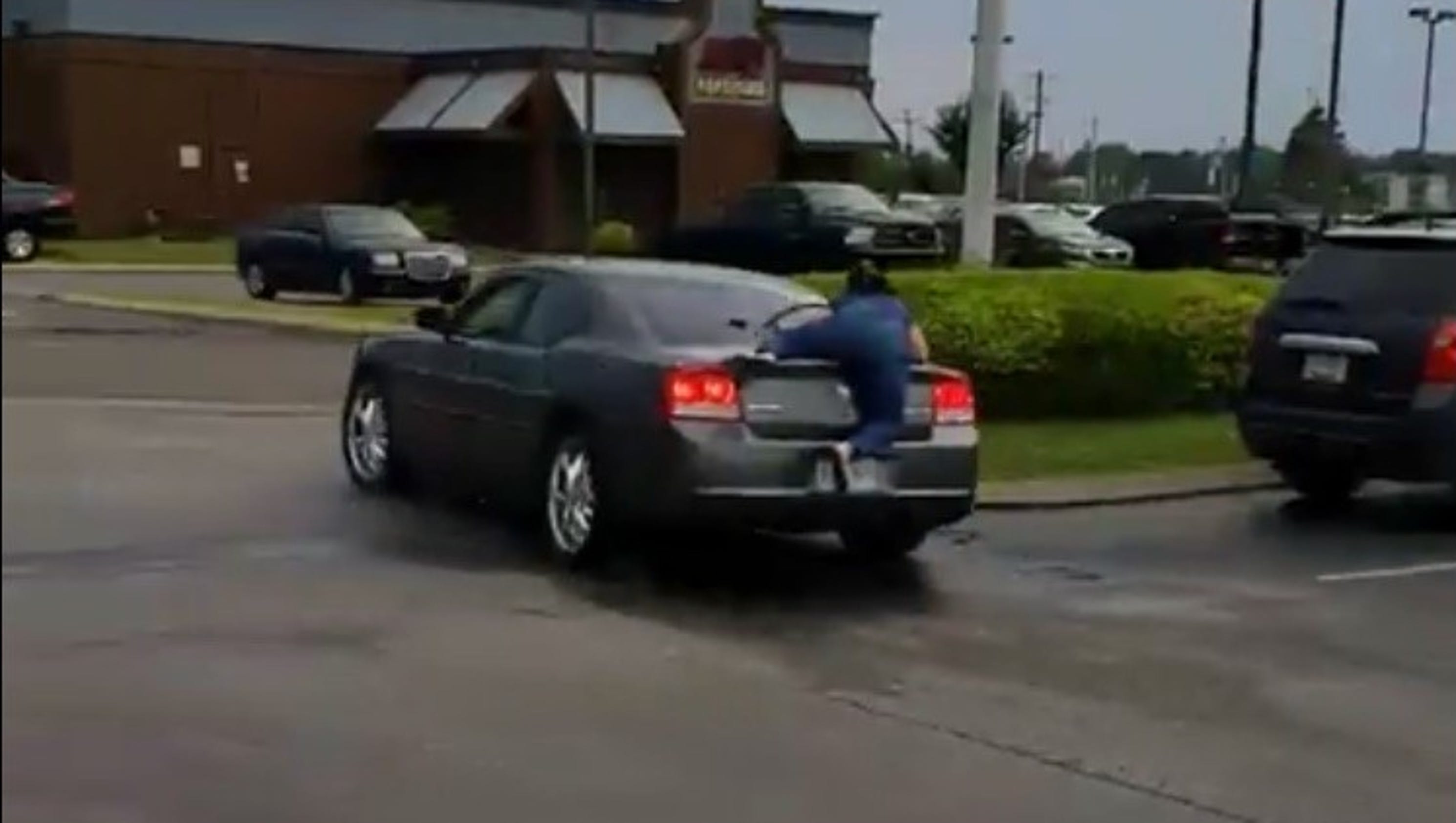 Viral videos: Jackson dispute shows woman riding on trunk ...