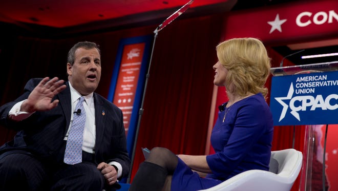 New Jersey Gov. Chris Christie speaks with Laura Ingraham during the Conservative Political Action Conference (CPAC) in National Harbor, Md., Thursday, Feb. 26, 2015. (AP Photo/Carolyn Kaster)