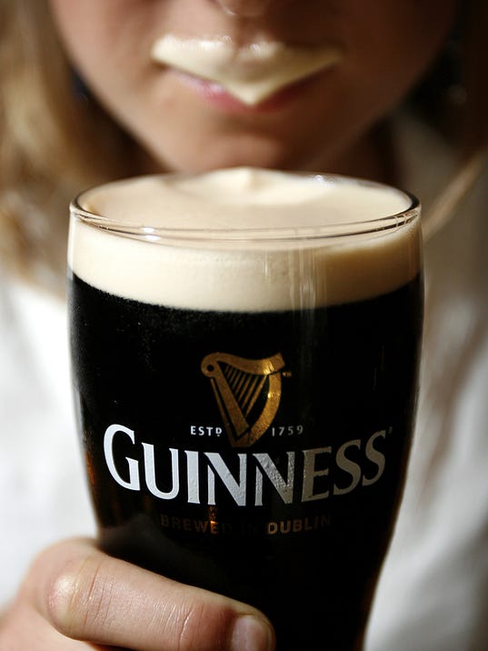 Image result for guinness woman drinking from glass