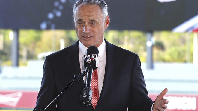 Baseball Commissioner Rob Manfred takes questions about the Houston Astros during a news conference at the Atlanta Braves' spring training facility Sunday, Feb. 16, 2020, in North Port, Fla. (Curtis Compton/Atlanta Journal-Constitution via AP) ORG XMIT: GAATJ324
