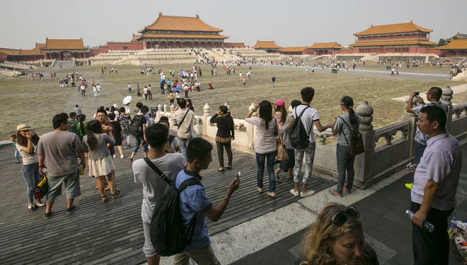 Forbidden City, Beijing, China, is seen awash with tourists Sunday during the Mid-Autumn Festival.