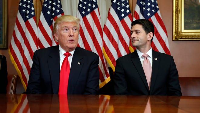 In this Nov. 10, 2016, photo, President-elect Donald Trump and House Speaker Paul Ryan of Wis., pose for photographers after a meeting in the Speaker's office on Capitol Hill in Washington. Washington’s new power trio consists of a bombastic billionaire, a telegenic policy wonk, and a taciturn political tactician. How well they can get along will help determine what gets done over the next four years, and whether the new president’s agenda founders or succeeds.