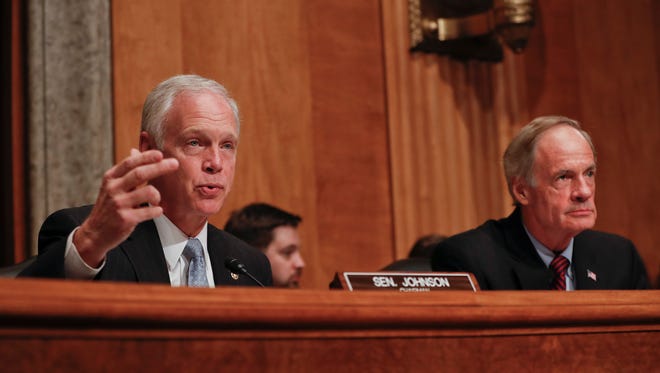 Senate Homeland Security and Governmental Affairs Committee Chairman Sen. Ron Johnson, R-Wis., left, accompanied by the committee's ranking member Sen. Tom Carper, D-Del., speaks on Capitol Hill in Washington, Tuesday, Sept. 27, 2016, during the committee's hearing on on terror threats.  (AP Photo/Pablo Martinez Monsivais)