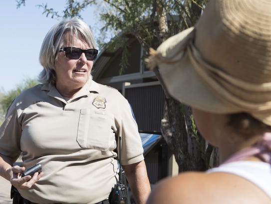 Lynn Swan, park ranger supervisor, speaks to Erika