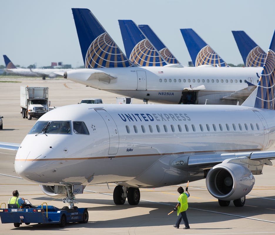A United Express Embraer E170 jet prepares for departure from Chicago O'Hare International Airport in June 2015.