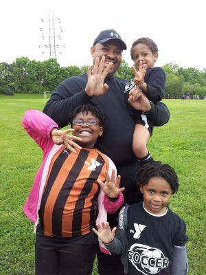David Tandy with his three children in June 2013