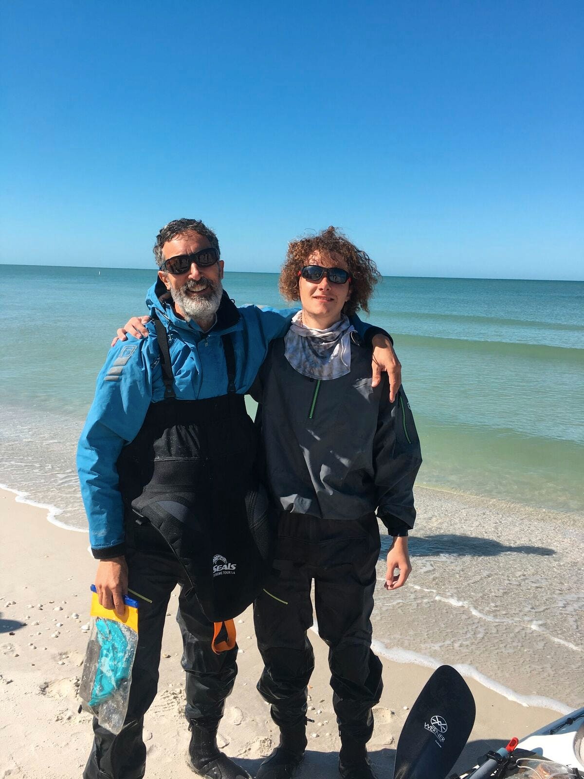Mark and Max stop at Lowdermilk Park for a pit stop and family visit. Naples father and son Mark Cecil and Maxfield Seixas competed in the Everglades Challenge endurance race, paddling 300 miles from St. Pete to Key Largo.