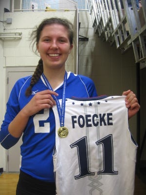 Mikaela Foecke of Fort Madison Holy Trinity has been a member of the USA Youth National volleyball team that played in Thailand and the U.S. Women’s Junior National Team. She displays her jersey and gold medal she won for the Junior National Team in Guatemala during the summer.