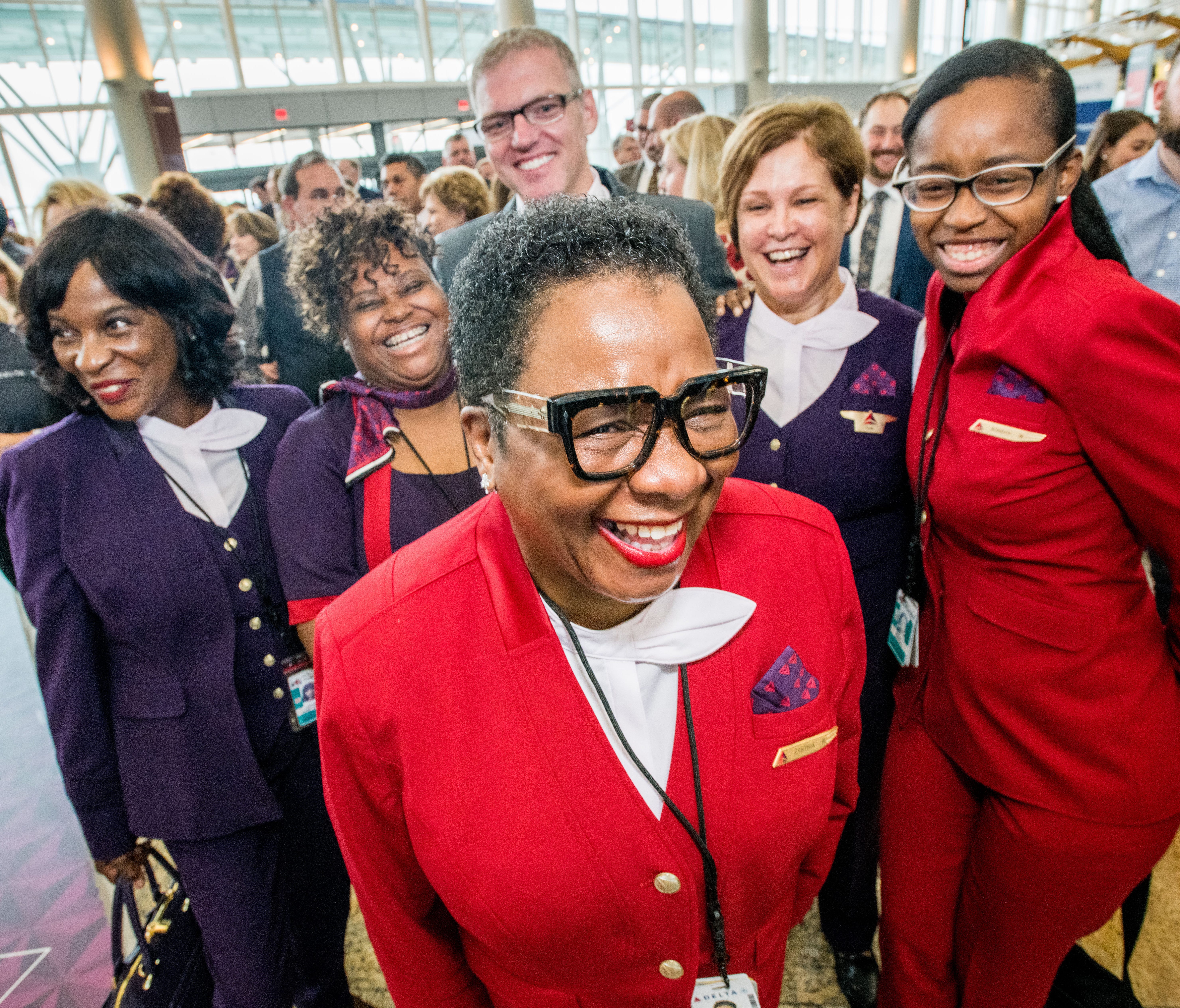 Delta employees pose at an Atlanta 