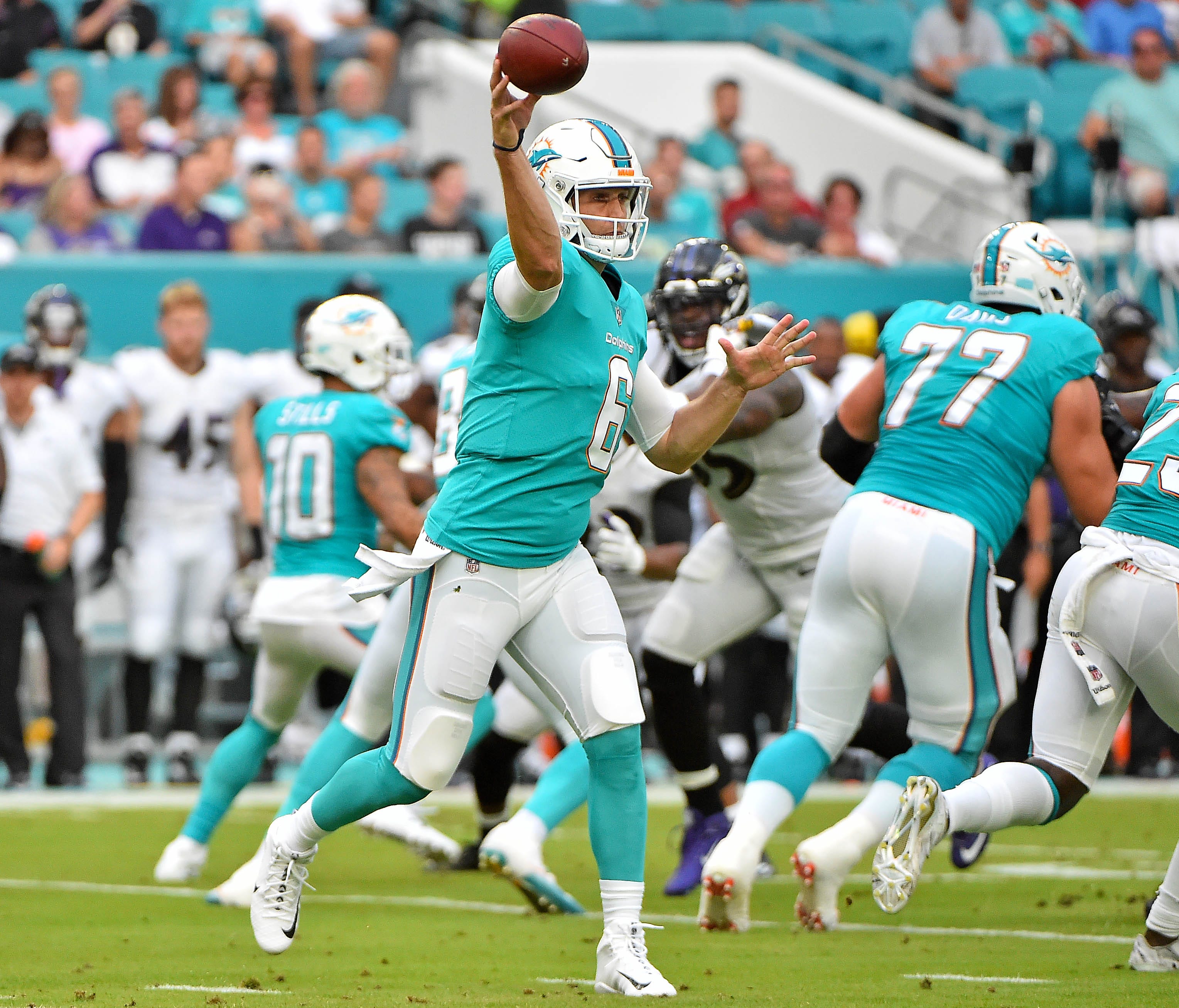 Miami Dolphins quarterback Jay Cutler (6) drops back to attempt a pass against the Baltimore Ravens during the first half at Hard Rock Stadium.