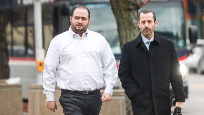 Joseph Ruff, left, enters federal court with his attorney Matt Parrinello Dec. 5, 2014. Ruff pleaded guilty to illegal gambling, an extortion conspiracy and a money-laundering conspiracy. The extortion conspiracy involved NHL star Thomas Vanek.