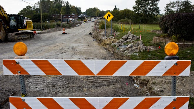 Curb work and paving has been delayed on Water Street in Port Huron Township. The opening of the roadway over Stocks Creek has been pushed back to Oct. 15.