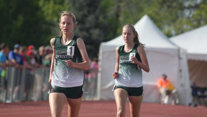 Heritage Christian's Rachel Rairdon, left, and Rebekah Rairdon run the 1A 3,200 on Thursday at the state meet. Rachel finished first and Rebekah took second.