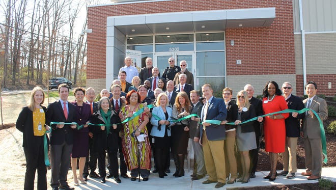 Representatives from Knox County, the City of Knoxville, the Tennessee Department of Mental Health, Helen Ross McNabb Center and community partners participate in the ribbon-cutting for the Behavioral Health Urgent Care Center last year.