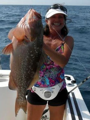 PIC OF THE WEEK 
Renee Carle caught her dandy red grouper in 70 feet of water off Redfish Pass, while fishing with her husband, Rick.