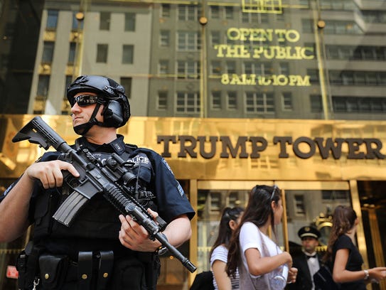 Police stand guard outside of Trump Tower on Aug. 4,