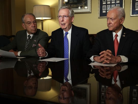 Senate Majority Leader Mitch McConnell speaks alongside