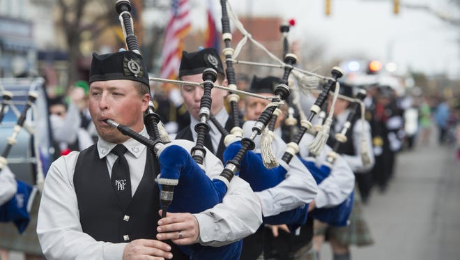 A band of bagpipers marches in the St. Patricks Day parade through Old Town Saturday, March 12, 2016.
