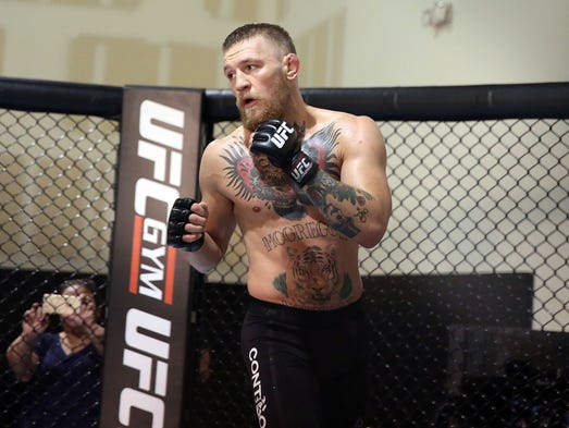 UFC featherweight champion Conor McGregor trains during