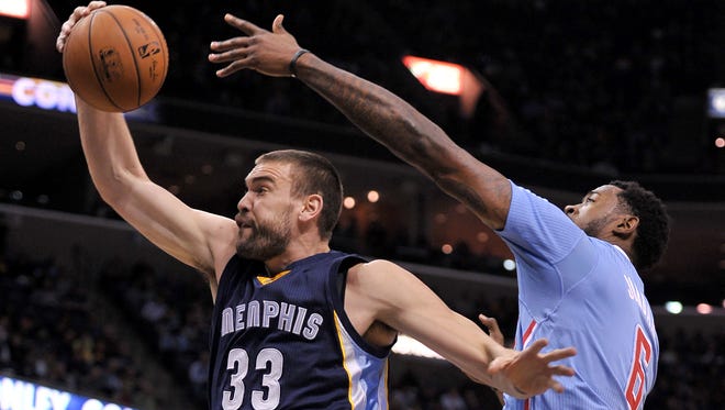 Memphis' Marc Gasol, left, battles the Clippers' DeAndre Jordan for a rebound in the first half on Sunday in Memphis, Tenn. Gasol had 30 points and 12 rebound in the Grizzlies' 107-91 rout of the Clippers.