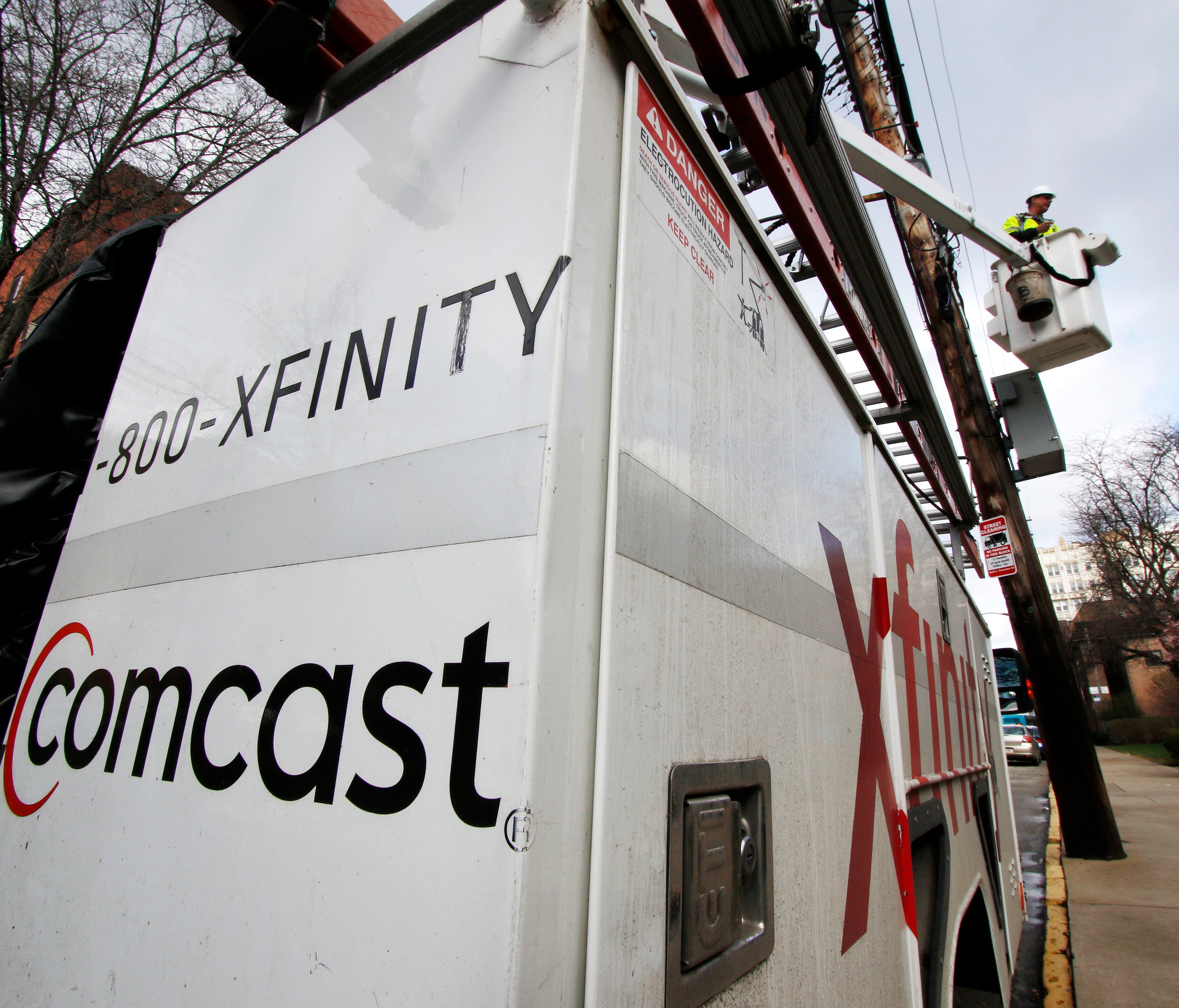 IFile photo taken in March 2017 shows a Comcast employee at work in Pittsburgh, Pa.