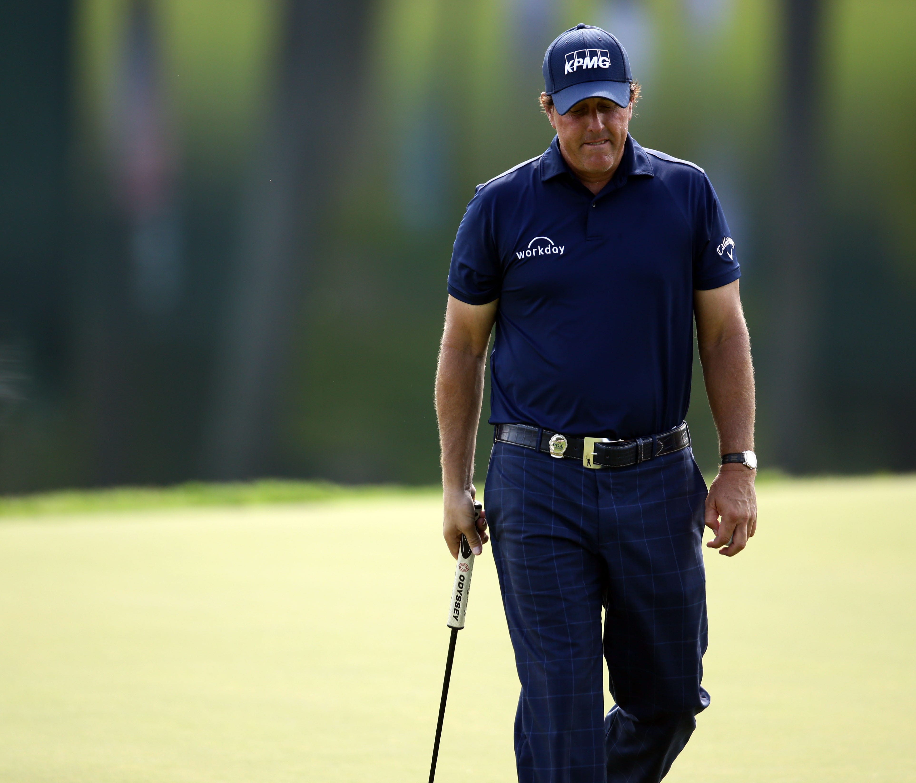 Phil Mickelson reacts to his putt on the 17th green during the second round of the 2017 PGA Championship at Quail Hollow Club on Aug. 11.