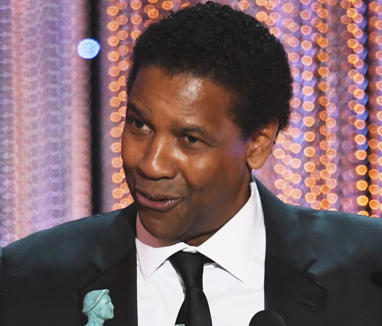 Denzel Washington accepts outstanding actor for his role in 'Fences' at Sunday's SAG Awards.