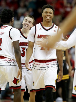 Louisville's Dwayne Sutton and Ryan McMahon were all smiles as the left the floor for a time out, after making a come back to take the lead against NKU. March 13, 2018