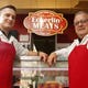 Josh, left, and Bob Lilis, right, of Eckerlin Meats in Over-the-Rhine's Findlay Market.