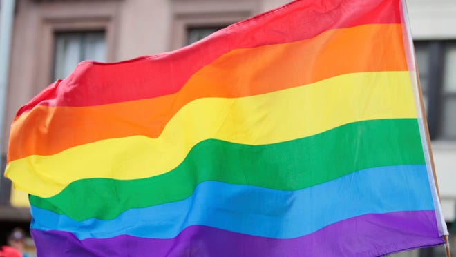 The LGBT pride flag is shown.