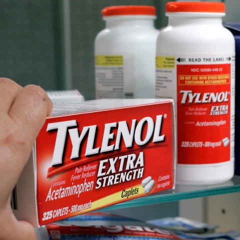 Tylenol Extra Strength is shown in a medicine cabi