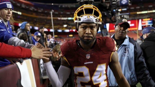 Cornerback Josh Norman of the Washington Redskins high fives fans after the New York Giants defeated the Washington Redskins 19-10 at FedExField on January 1, 2017 in Landover, Maryland.