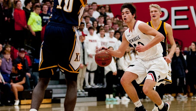 Aidan Nordquist of Pewaukee brings the ball up the court against Pius XI on Friday night.