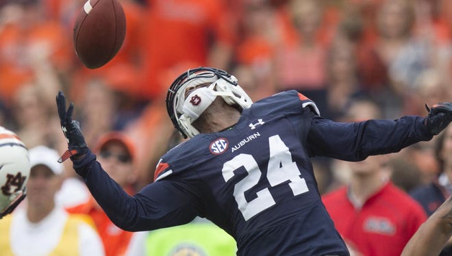 Auburn defensive back Blake Countess (24) intercepts a pass last fall. At least 10 NFL teams have inquired about Countess in advance of the draft this week.