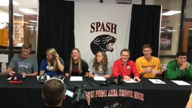 Seven senior SPASH student-athletes (from left) Matt McHugh, Shaylee Kluck, Payton Gaber, Kathryn Stupar, Fritz Schierl, Sam Hauser and Trev Anderson signed letters-of-intent or pledge commitments to colleges in their respective sports in a ceremony at the school Wednesday.