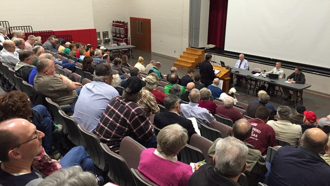 Keith Rowland, at the lectern, addresses representatives from the Federal Energy Regulatory Commission during the agency's public hearing on the Rover gas pipeline's draft environmental impact statement, Wednesday at Buckeye Central High School in New Washington.
