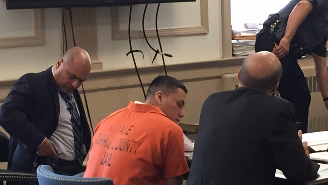 From left, Spanish-to-English interpreter Jorge Vazquez, attempted murder suspect William Jimbo-Aucapina, and defense lawyer Michael Fletcher at pretrial hearing  July 18, 2016, in Superior Court, Morristown.