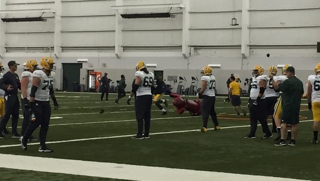 The Packers practice inside the Don Hutson Center.
