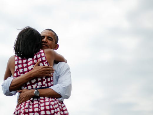 President Obama  hugs Michelle after delivering remarks