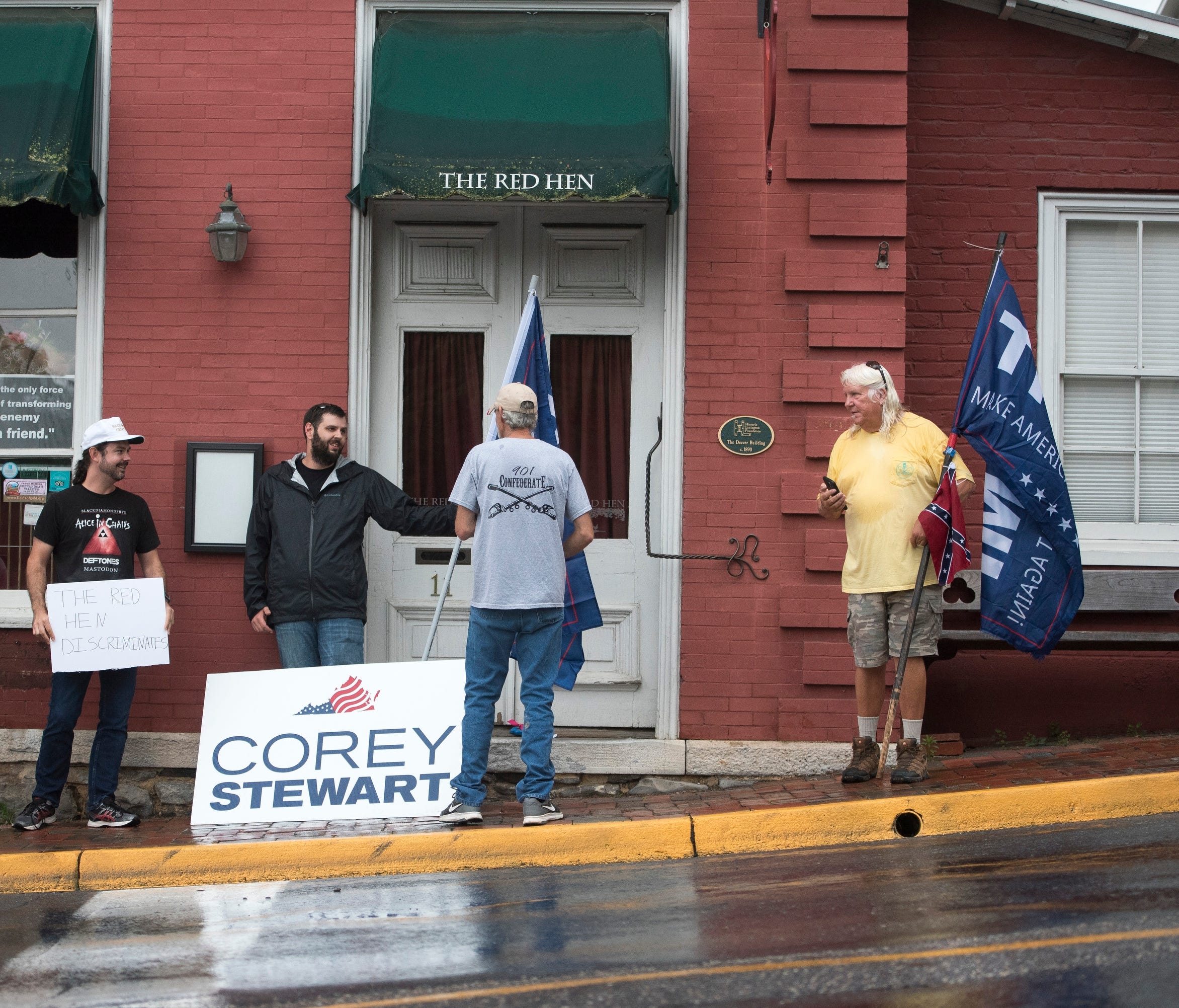 Trump supporters stand outside of the Red Hen June 26 after Sarah Huckabee Sanders was unceremoniously evicted from the Virginia restaurant.
