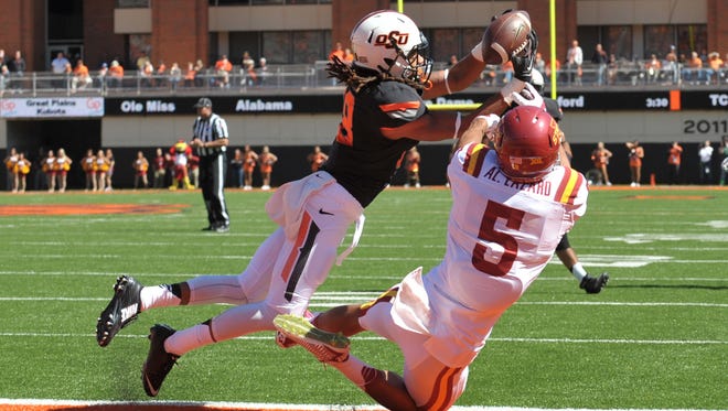 Oklahoma State Cowboys cornerback Ramon Richards (18) intercepted a pass intended for Iowa State Cyclones wide receiver Allen Lazard (5) during the second half but it is called back on a penalty.